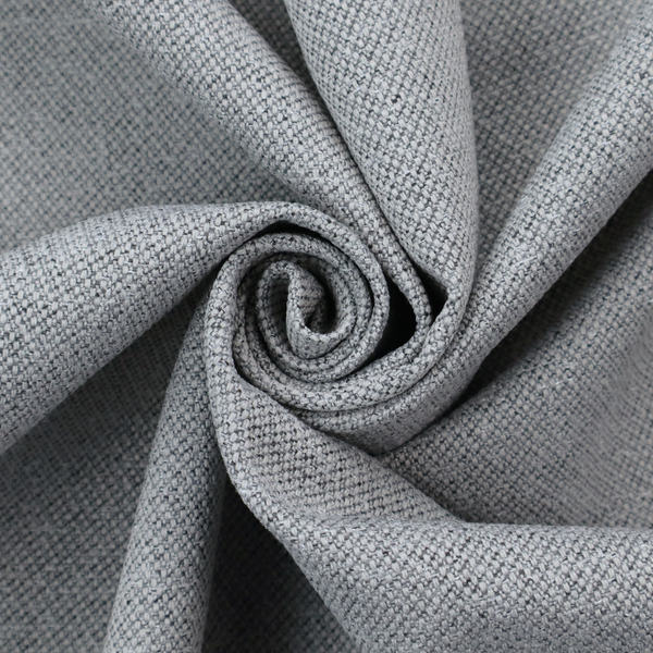 A cool steel or light blue-grey textile featuring a tight diagonal twill weave. The fabric is a multi-tonal blend, interlacing medium grey yarns with pale blue and crisp white threads, creating a clean, heathered appearance.