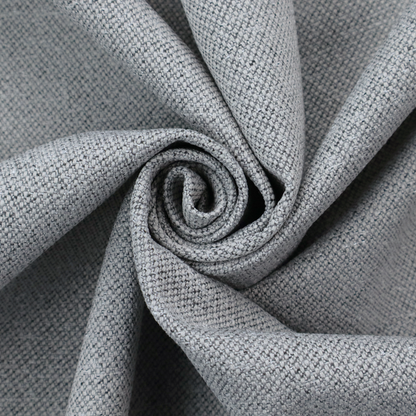 A cool steel or light blue-grey textile featuring a tight diagonal twill weave. The fabric is a multi-tonal blend, interlacing medium grey yarns with pale blue and crisp white threads, creating a clean, heathered appearance.