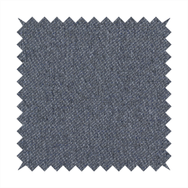 A seal grey textile featuring a tight diagonal twill weave. The fabric is a multi-tonal blend, interlacing deep charcoal and slate yarns with subtle flecks of lighter grey and muted blue, creating a sophisticated, heathered depth.