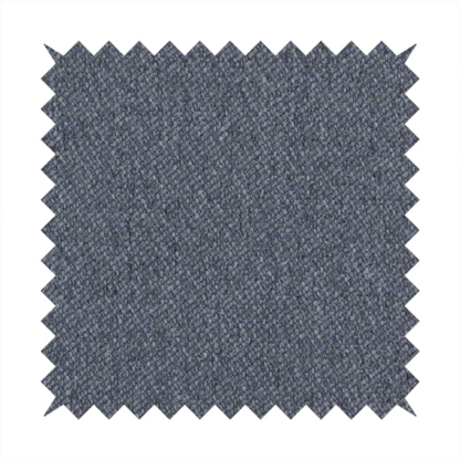 A seal grey textile featuring a tight diagonal twill weave. The fabric is a multi-tonal blend, interlacing deep charcoal and slate yarns with subtle flecks of lighter grey and muted blue, creating a sophisticated, heathered depth.