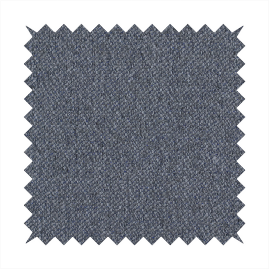 A seal grey textile featuring a tight diagonal twill weave. The fabric is a multi-tonal blend, interlacing deep charcoal and slate yarns with subtle flecks of lighter grey and muted blue, creating a sophisticated, heathered depth.
