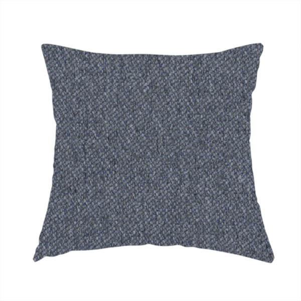 The fabric used to create this handmade cushion is a seal grey textile featuring a tight diagonal twill weave. The fabric is a multi-tonal blend, interlacing deep charcoal and slate yarns with subtle flecks of lighter grey and muted blue, creating a sophisticated, heathered depth.
