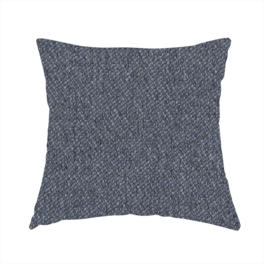 The fabric used to create this handmade cushion is a seal grey textile featuring a tight diagonal twill weave. The fabric is a multi-tonal blend, interlacing deep charcoal and slate yarns with subtle flecks of lighter grey and muted blue, creating a sophisticated, heathered depth.