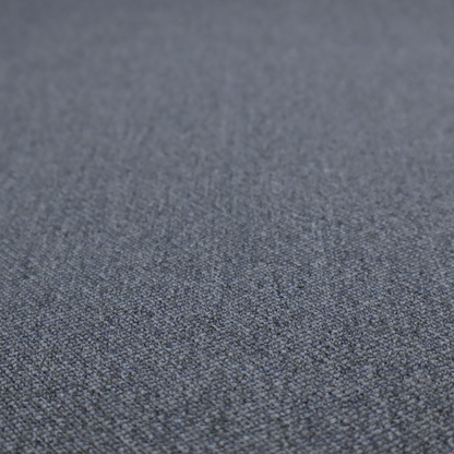 A seal grey textile featuring a tight diagonal twill weave. The fabric is a multi-tonal blend, interlacing deep charcoal and slate yarns with subtle flecks of lighter grey and muted blue, creating a sophisticated, heathered depth.