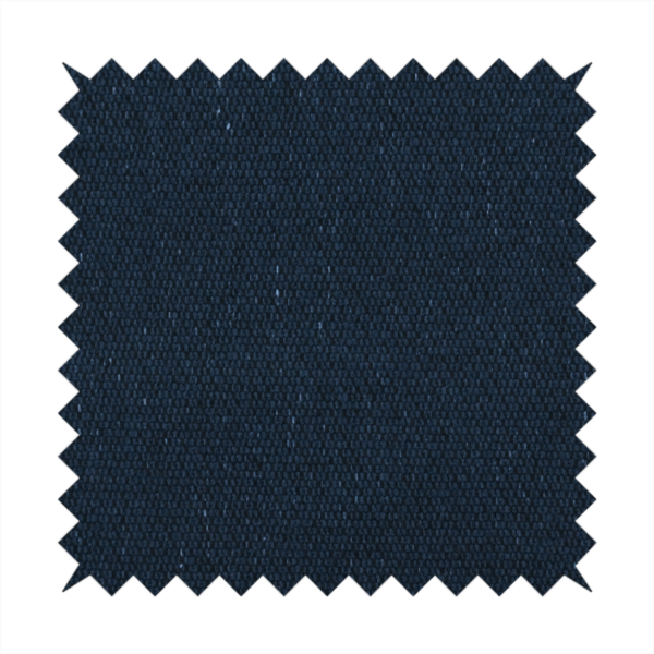 A deep navy or midnight blue textile featuring a tight diagonal twill weave. The fabric is woven primarily with saturated dark blue yarns, interspersed with very fine, sparse white or light grey flecks that create a subtle starlight effect.