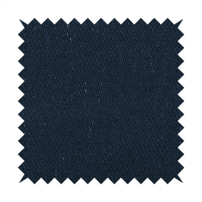 A deep navy or midnight blue textile featuring a tight diagonal twill weave. The fabric is woven primarily with saturated dark blue yarns, interspersed with very fine, sparse white or light grey flecks that create a subtle starlight effect.