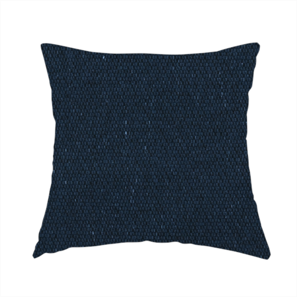 The fabric used to create this handmade cushion is a deep navy or midnight blue textile featuring a tight diagonal twill weave. The fabric is woven primarily with saturated dark blue yarns, interspersed with very fine, sparse white or light grey flecks that create a subtle starlight effect.