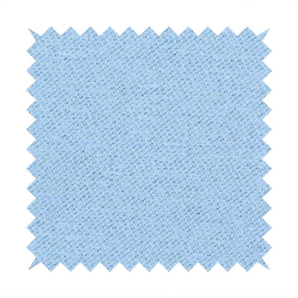 A sky blue or powder blue textile featuring a tight diagonal twill weave. The fabric is woven with bright, airy blue yarns interlaced with crisp white threads, creating a fresh, luminous, and slightly heathered appearance.