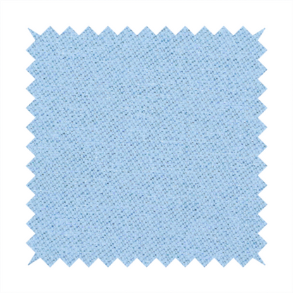 A sky blue or powder blue textile featuring a tight diagonal twill weave. The fabric is woven with bright, airy blue yarns interlaced with crisp white threads, creating a fresh, luminous, and slightly heathered appearance.