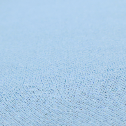 A sky blue or powder blue textile featuring a tight diagonal twill weave. The fabric is woven with bright, airy blue yarns interlaced with crisp white threads, creating a fresh, luminous, and slightly heathered appearance.