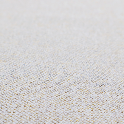 a light oatmeal or pearl grey textile featuring a tight diagonal twill weave. The fabric is a multi-tonal blend, interlacing crisp white and pale grey yarns with subtle flecks of soft gold and charcoal, creating a luminous, heathered appearance.