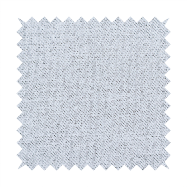 A very pale, cool grey with crisp white and charcoal flecks; bright and airy.