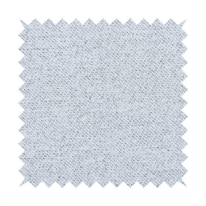 A very pale, cool grey with crisp white and charcoal flecks; bright and airy.