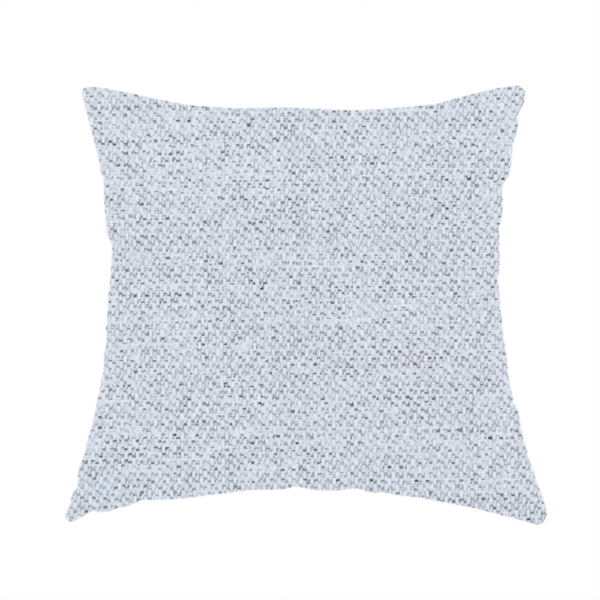The fabric used to create this handmade cushion is a very pale, cool grey with crisp white and charcoal flecks; bright and airy.