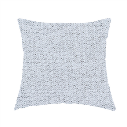 The fabric used to create this handmade cushion is a very pale, cool grey with crisp white and charcoal flecks; bright and airy.