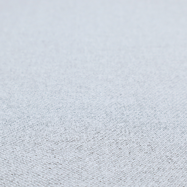 A very pale, cool grey with crisp white and charcoal flecks; bright and airy.
