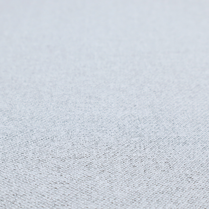 A very pale, cool grey with crisp white and charcoal flecks; bright and airy.