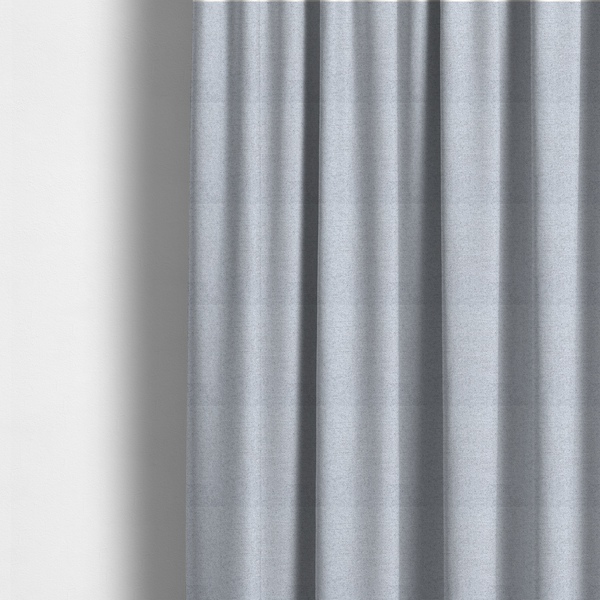 The fabric used to create these made-to-measure curtains is a very pale, cool grey with crisp white and charcoal flecks; bright and airy.