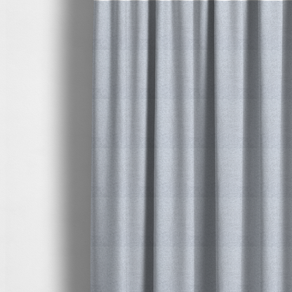 The fabric used to create these made-to-measure curtains is a very pale, cool grey with crisp white and charcoal flecks; bright and airy.