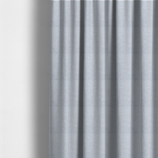 The fabric used to create these made-to-measure curtains is a very pale, cool grey with crisp white and charcoal flecks; bright and airy.