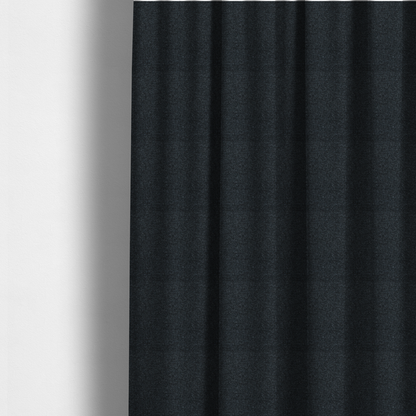 The fabric used to create these made-to-measure curtains is a near-black charcoal base with dense, icy blue and silver flecks.