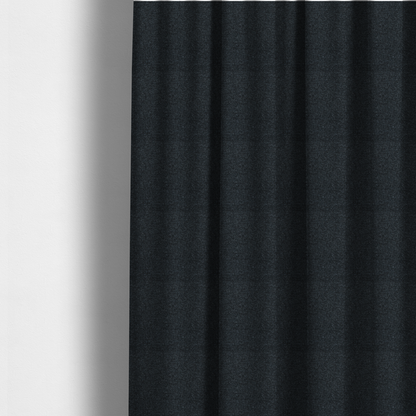 The fabric used to create these made-to-measure curtains is a near-black charcoal base with dense, icy blue and silver flecks.