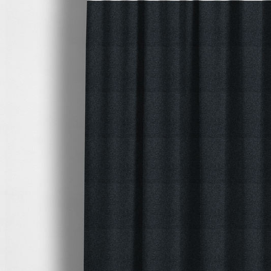 The fabric used to create these made-to-measure curtains is a near-black charcoal base with dense, icy blue and silver flecks.