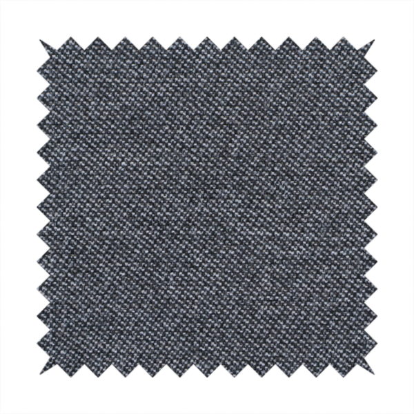 Dark, smoky grey with heavy white flecking; high-contrast heather.