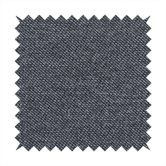 Dark, smoky grey with heavy white flecking; high-contrast heather.