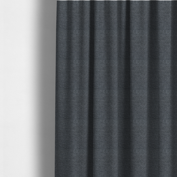 The fabric used to create these made-to-measure curtains is a dark, smoky grey with heavy white flecking; high-contrast heather.