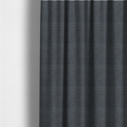 The fabric used to create these made-to-measure curtains is a dark, smoky grey with heavy white flecking; high-contrast heather.