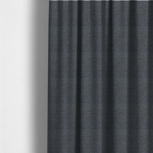 The fabric used to create these made-to-measure curtains is a dark, smoky grey with heavy white flecking; high-contrast heather.