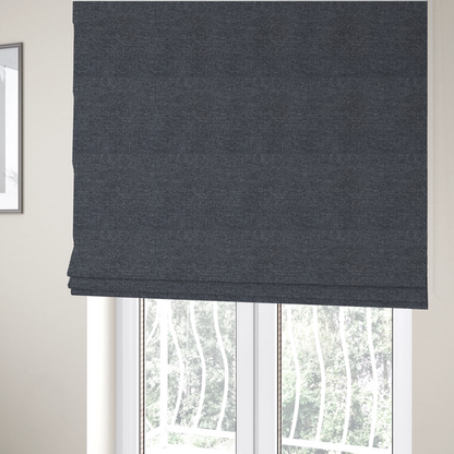 The fabric used to create these Roman blinds is a dark, smoky grey with heavy white flecking; high-contrast heather.