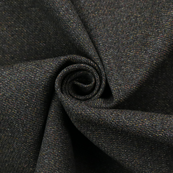 A near-black charcoal base heavily flecked with multi-coloured yarns in gold, rust, and grey.