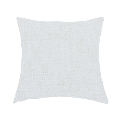 The fabric used to create this handmade cushion is a light-coloured, off-white fabric with a fine, textured weave.