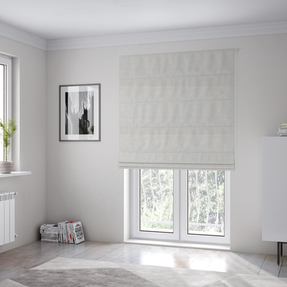 The fabric used to create these Roman blinds is a light beige upholstery fabric with a fine, textured weave.