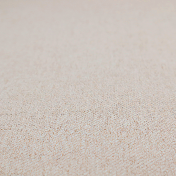A light beige and tan upholstery fabric with a fine, multi-tonal textured weave.