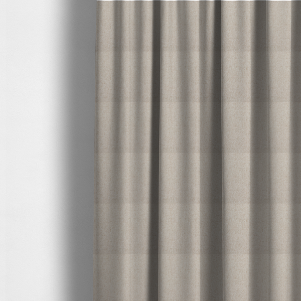 The fabric used to create these made-to-measure curtains is a light beige and tan upholstery fabric with a fine, multi-tonal textured weave.