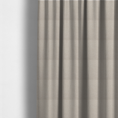 The fabric used to create these made-to-measure curtains is a light beige and tan upholstery fabric with a fine, multi-tonal textured weave.