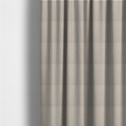 The fabric used to create these made-to-measure curtains is a light beige and tan upholstery fabric with a fine, multi-tonal textured weave.