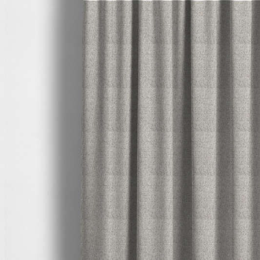 The fabric used to create these made-to-measure curtains is a taupe and grey upholstery fabric with a dense, multi-tonal textured weave.