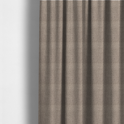 The fabric used to create these made-to-measure curtains is a warm grey and brown upholstery fabric with a dense, diagonal textured weave.