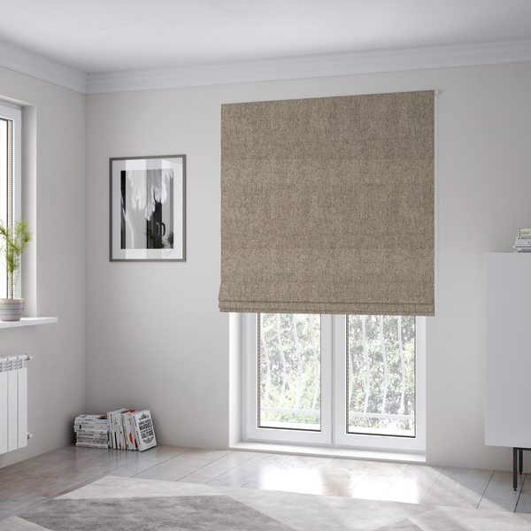 The fabric used to create these Roman blinds is a warm grey and brown upholstery fabric with a dense, diagonal textured weave.