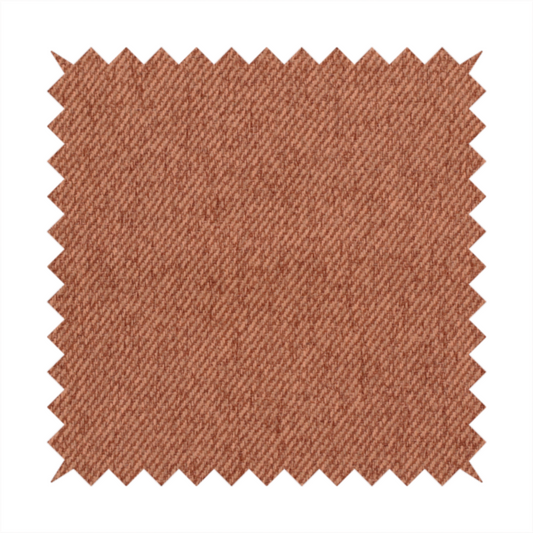 A rust-orange upholstery fabric with a dense, diagonal textured weave.