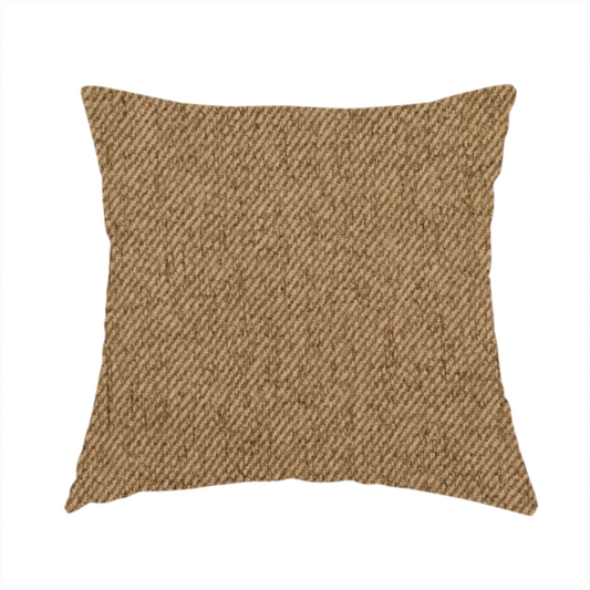 The fabric used to create this handmade cushion is a golden-brown upholstery fabric with a dense, diagonal textured weave.