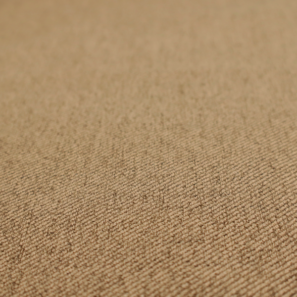 A golden-brown upholstery fabric with a dense, diagonal textured weave.