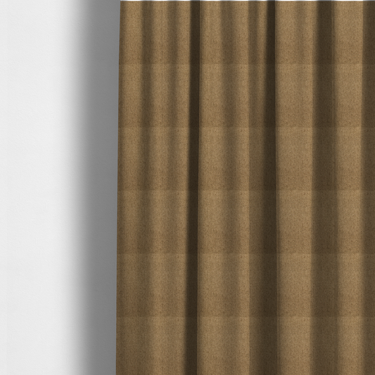 The fabric used to create these made-to-measure curtains is a golden-brown upholstery fabric with a dense, diagonal textured weave.