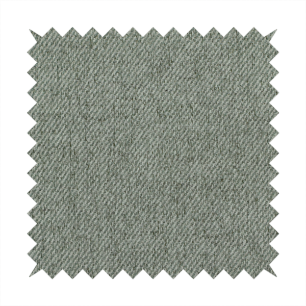 A sage green upholstery fabric with a dense, diagonal textured weave.