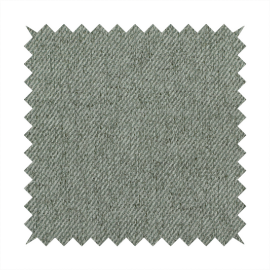 A sage green upholstery fabric with a dense, diagonal textured weave.