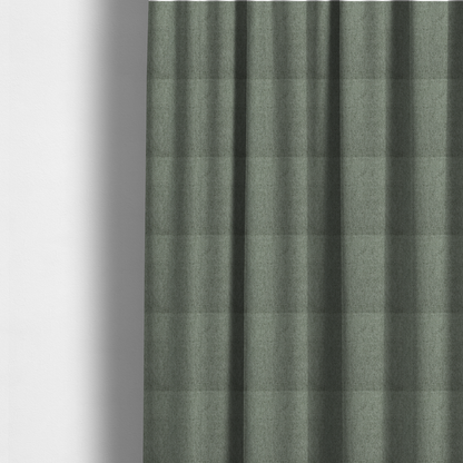 The fabric used to create these made-to-measure curtains is a sage green upholstery fabric with a dense, diagonal textured weave.